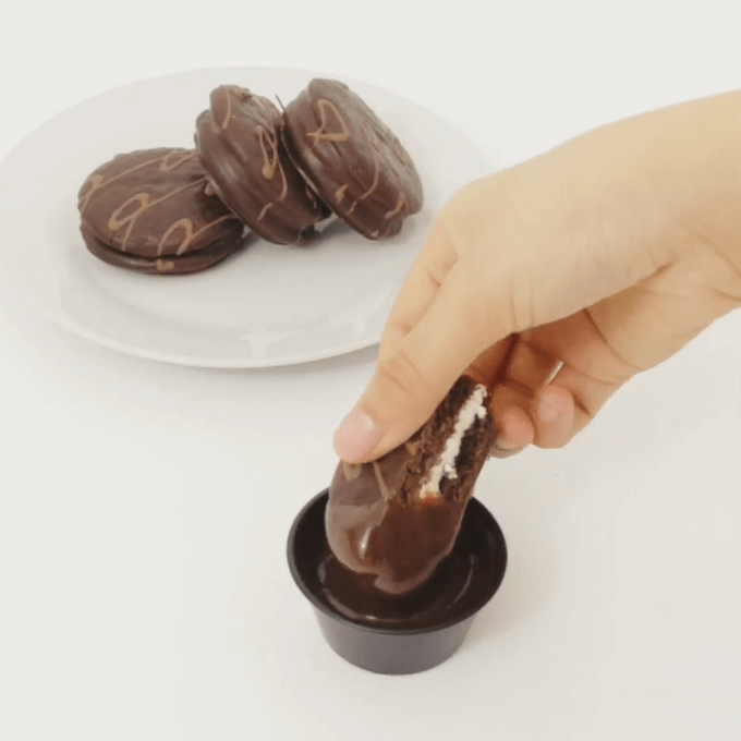 Dipping Chocolate Cream Pie into Chocolate Sauce